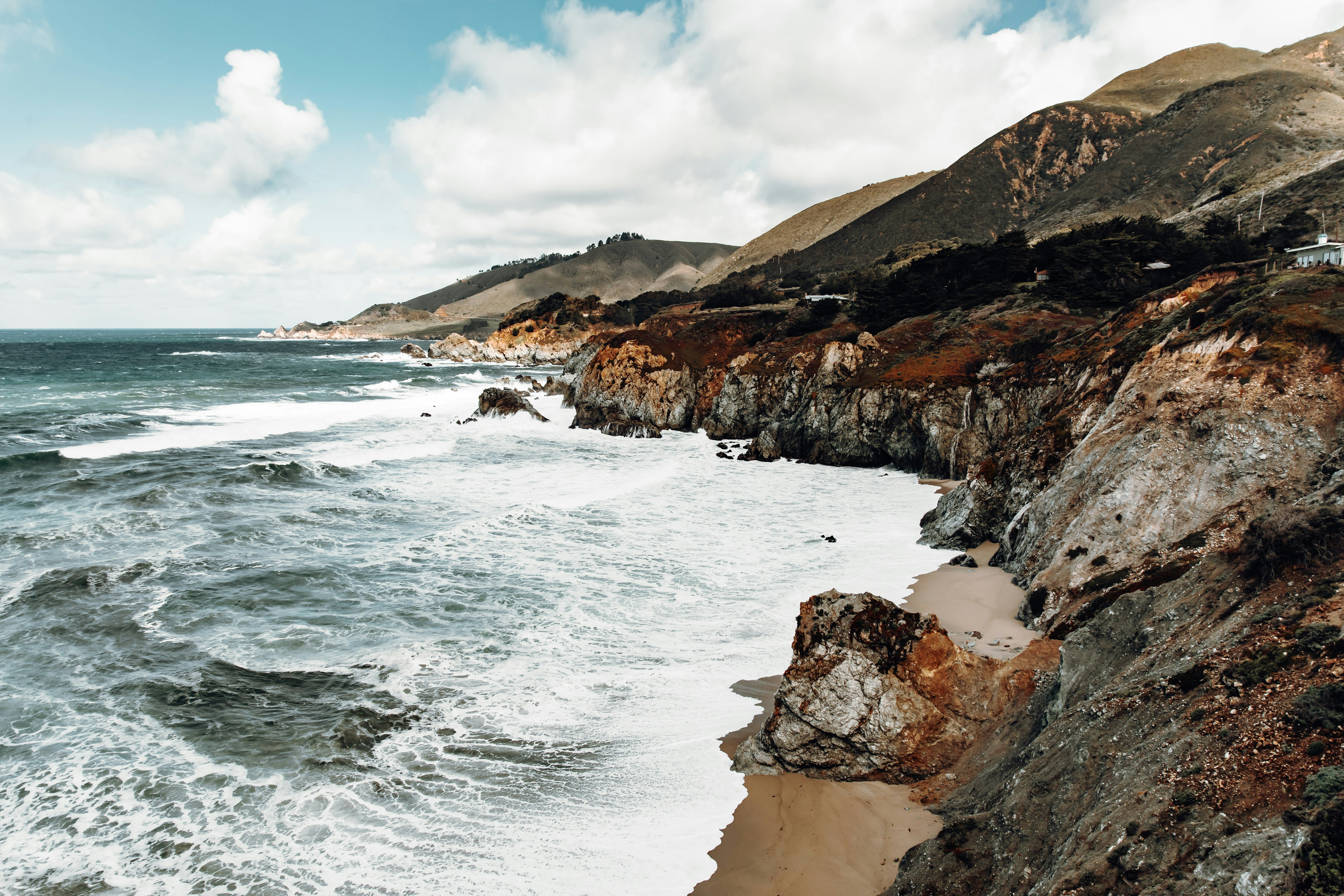 ocean under cloudy sky